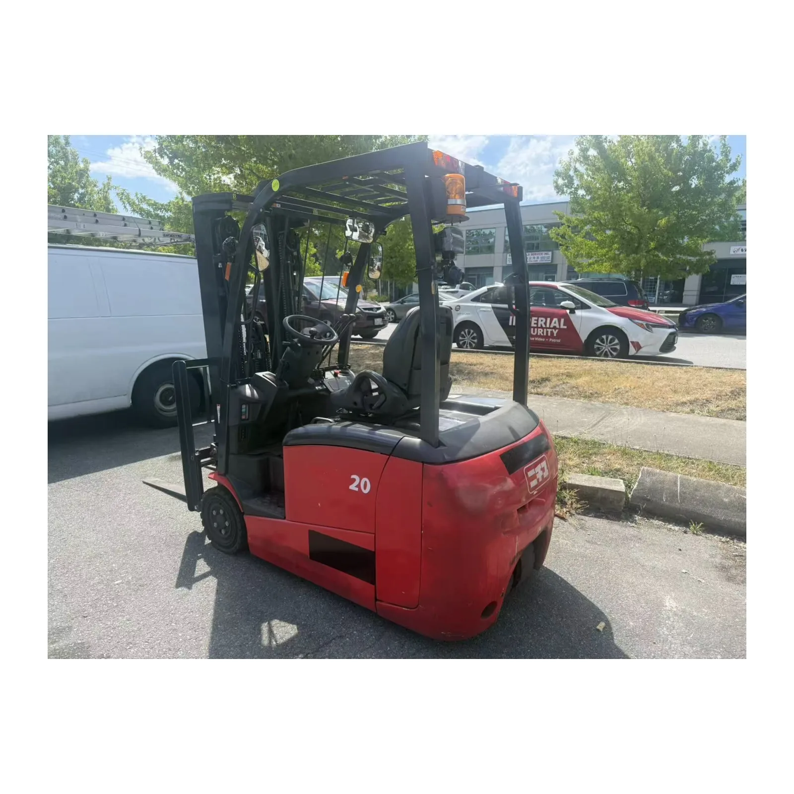 Electric forklift, red, rear three-quarter view